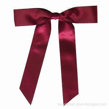 Polyester ribbon hand tied gift bow with adhesive tab at back, burgundy color